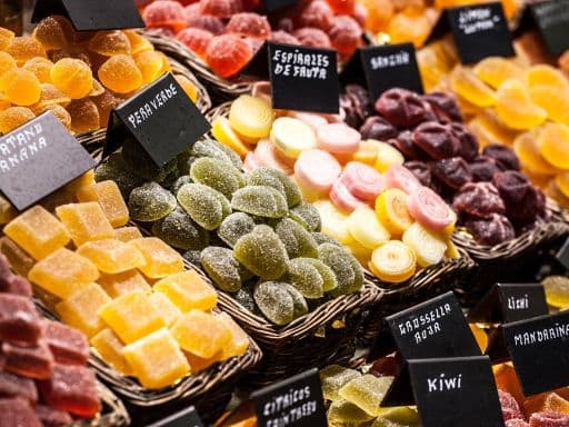 Market stall full of candys in La Boqueria Market. Barcelona. Catalonia