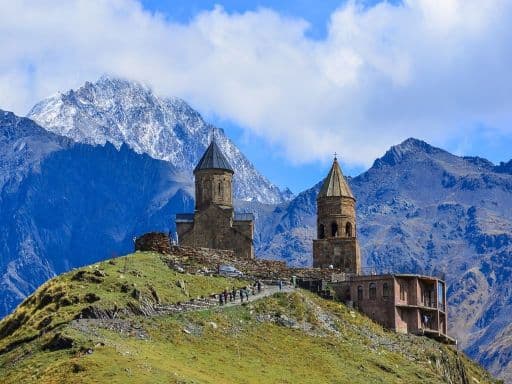 Gergeti Trinity Church (Tsminda Sameba) in Kazbegi, Georgia. The Church near the village of Gergeti - shutterstock_1332140534