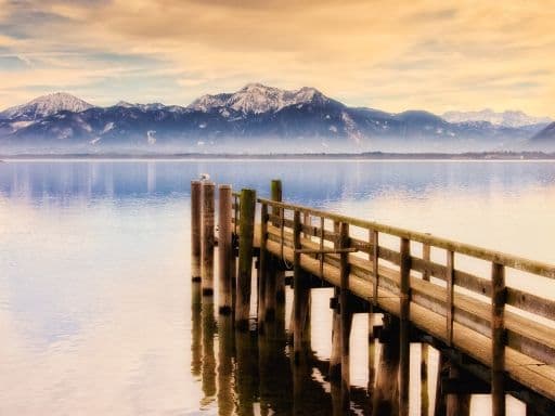 jetty on Lake Chiemsee with mountains
